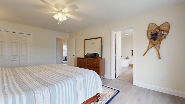 48 Lubear Way, Auburn, ME 04210 - bedroom featuring light wood-style floors, a closet, baseboards, ceiling fan, and connected bathroom