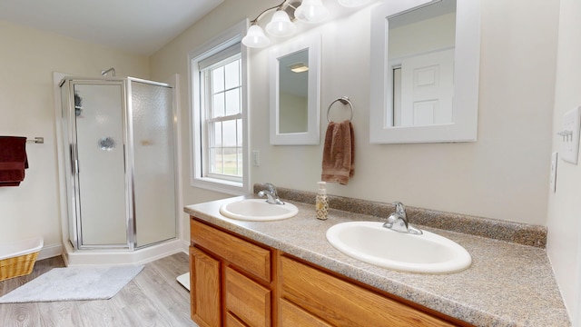48 Lubear Way, Auburn, ME 04210 - bathroom with a shower stall, double vanity, and wood finished floors