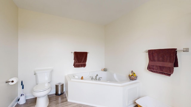 48 Lubear Way, Auburn, ME 04210 - full bath featuring toilet, a garden tub, wood finished floors, and baseboards