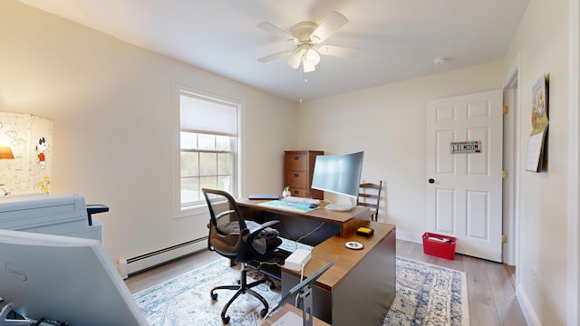 48 Lubear Way, Auburn, ME 04210 - office area with baseboard heating, light wood-style flooring, a ceiling fan, and baseboards