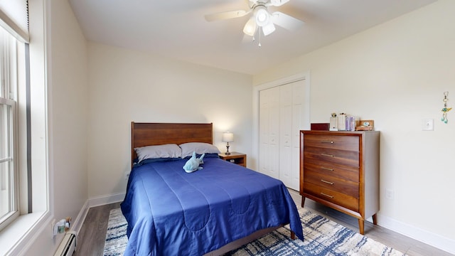 48 Lubear Way, Auburn, ME 04210 - bedroom with wood finished floors, a closet, baseboards, and baseboard heating
