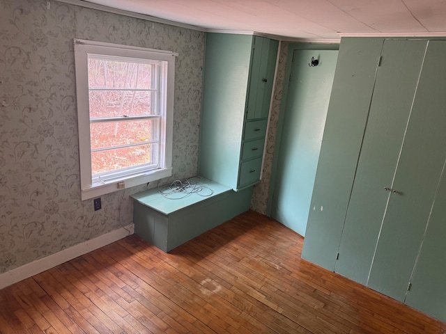 6 Mcdevitt Ln, Eastbrook, ME 04634 - unfurnished room with wallpapered walls and light wood-type flooring