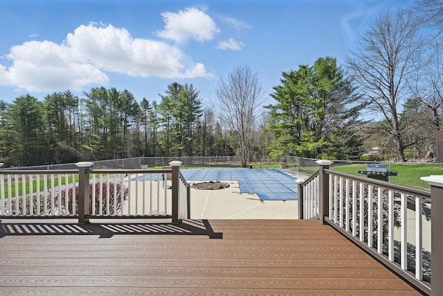 128 Capen Rd, Gardiner, ME 04345 - deck featuring a patio, a fenced in pool, and fence