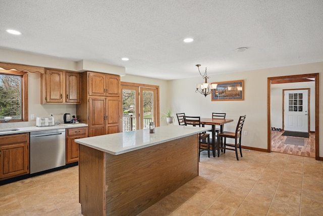 128 Capen Rd, Gardiner, ME 04345 - kitchen featuring brown cabinetry, decorative light fixtures, recessed lighting, dishwasher, and light countertops