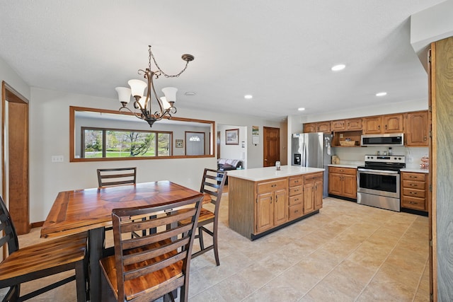 128 Capen Rd, Gardiner, ME 04345 - kitchen with recessed lighting, light countertops, a center island, a notable chandelier, and appliances with stainless steel finishes
