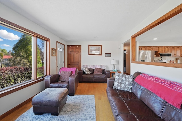 128 Capen Rd, Gardiner, ME 04345 - living area featuring a wealth of natural light, light wood finished floors, and recessed lighting