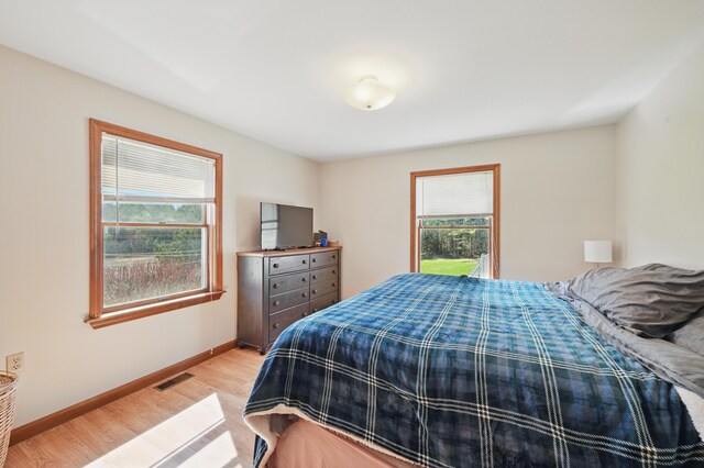 128 Capen Rd, Gardiner, ME 04345 - bedroom featuring baseboards, light wood-type flooring, and visible vents