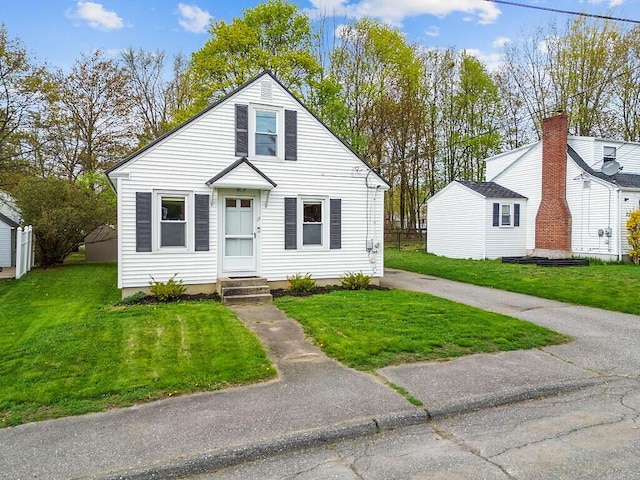 19 Fourth Ave, Augusta, ME 04330 - bungalow-style home with a front lawn