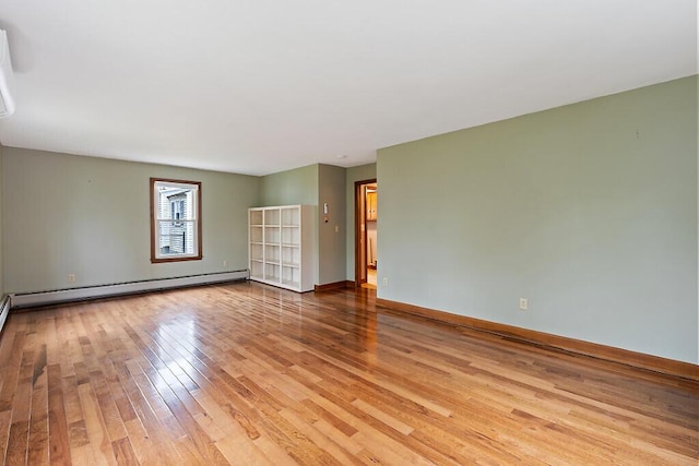 19 Fourth Ave, Augusta, ME 04330 - spare room featuring baseboard heating, light wood-style flooring, and baseboards