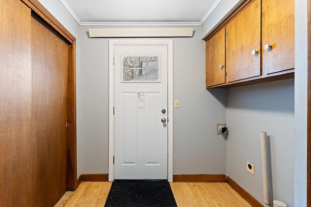 19 Fourth Ave, Augusta, ME 04330 - laundry area with cabinet space, electric dryer hookup, light wood-type flooring, ornamental molding, and baseboards