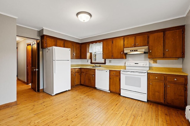 19 Fourth Ave, Augusta, ME 04330 - kitchen featuring white appliances, under cabinet range hood, light countertops, brown cabinetry, and crown molding