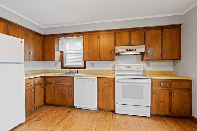 19 Fourth Ave, Augusta, ME 04330 - kitchen with white appliances, under cabinet range hood, a sink, brown cabinetry, and ornamental molding