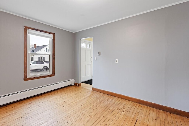 19 Fourth Ave, Augusta, ME 04330 - unfurnished room with a baseboard heating unit, baseboards, light wood finished floors, and crown molding