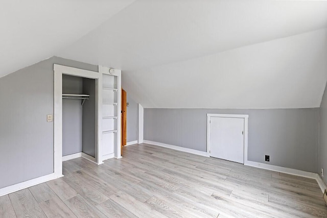 19 Fourth Ave, Augusta, ME 04330 - additional living space with vaulted ceiling, light wood-type flooring, and baseboards