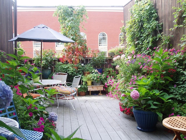 139 Newbury St, Portland, ME 04101 - view of wooden balcony with a deck and outdoor dining space