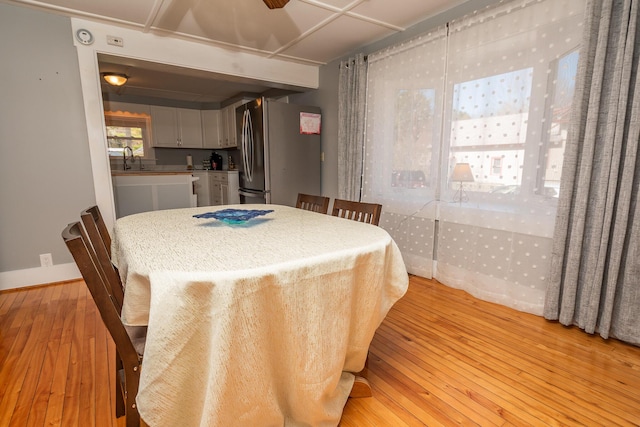 dining area featuring light wood finished floors