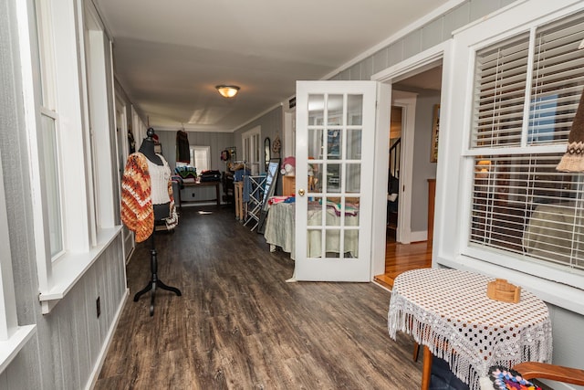 interior space featuring french doors, wood finished floors, and ornamental molding