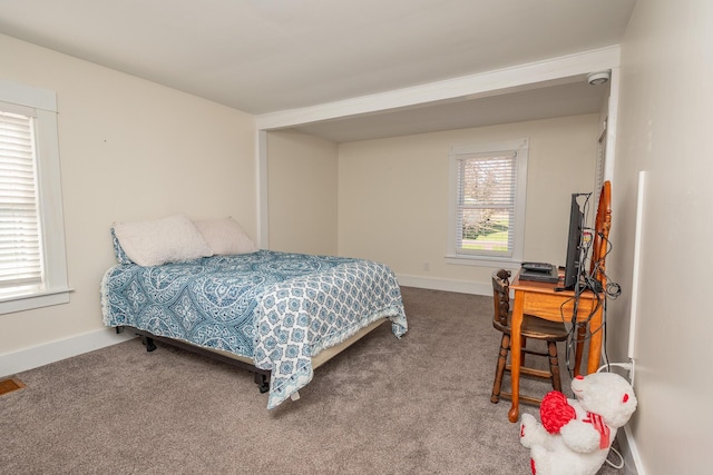 carpeted bedroom with baseboards