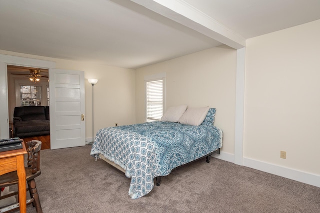 carpeted bedroom featuring multiple windows