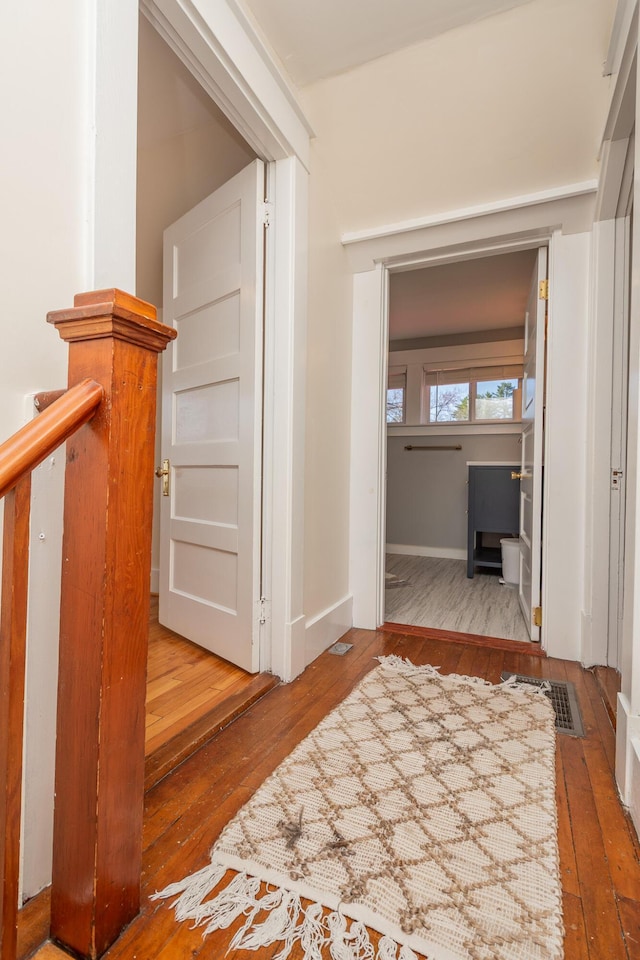 hallway with wood-type flooring