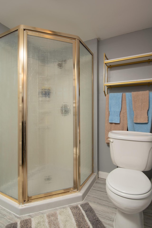 full bathroom with baseboards and a shower stall