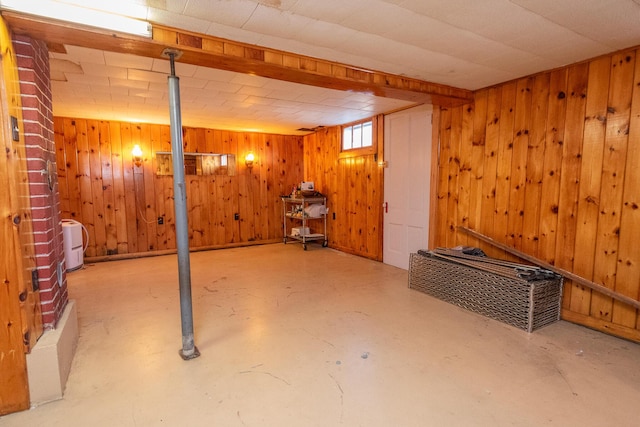 basement featuring wood walls