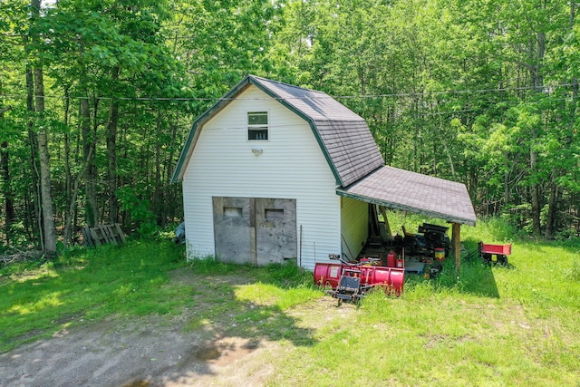 349 Veterans Hwy, Brooks, ME 04921 - view of barn featuring a wooded view
