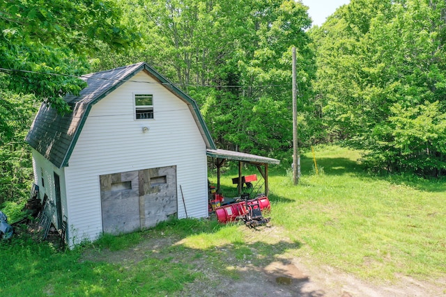 349 Veterans Hwy, Brooks, ME 04921 - garage with a wooded view