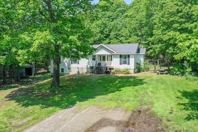 349 Veterans Hwy, Brooks, ME 04921 - view of front facade with a front yard and a porch