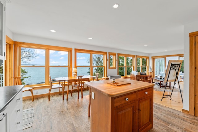 21 White Rd, Georgetown, ME 04548 - kitchen featuring light wood finished floors, wooden counters, a center island, a water view, and recessed lighting