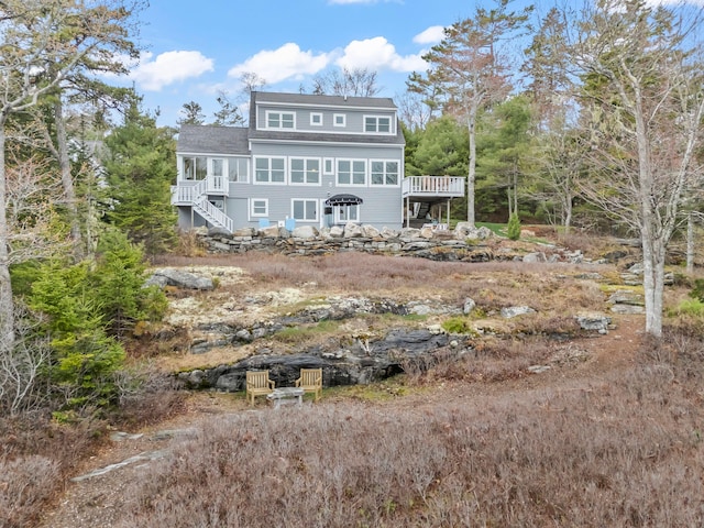 21 White Rd, Georgetown, ME 04548 - back of property featuring stairway and a wooden deck