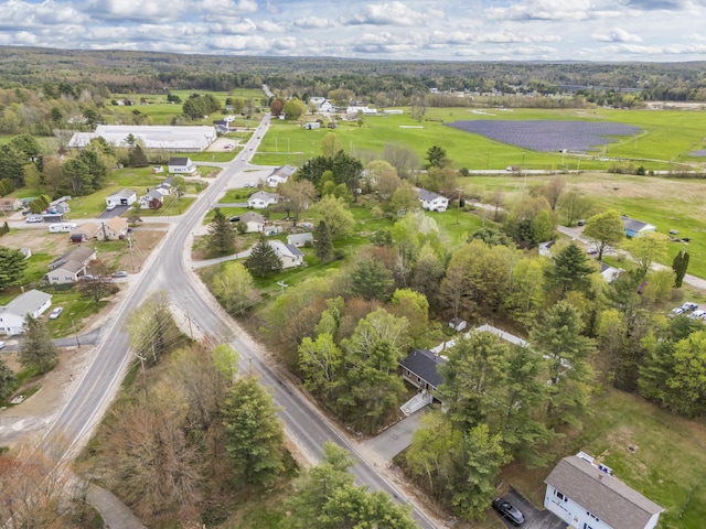 aerial view of property and surrounding area with nearby suburban area
