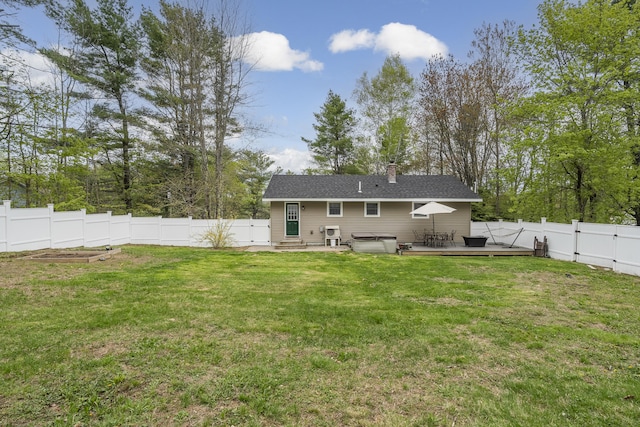 rear view of property with entry steps, a wooden deck, a chimney, and a gate