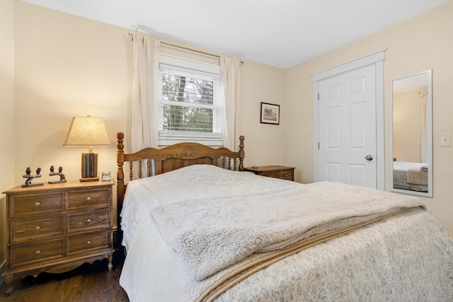 bedroom featuring dark wood-style floors
