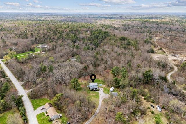 aerial overview of property's location featuring a heavily wooded area
