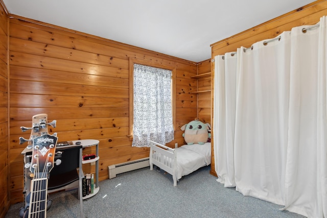 bedroom with a baseboard heating unit, carpet floors, and wooden walls