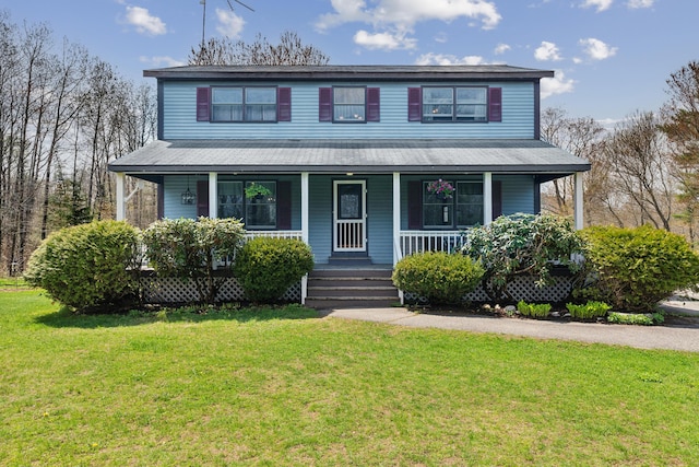 view of front of home with covered porch and a front lawn