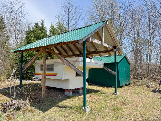 111 Fryes Ln, Greenbush, ME 04418 - view of parking / parking lot featuring a carport