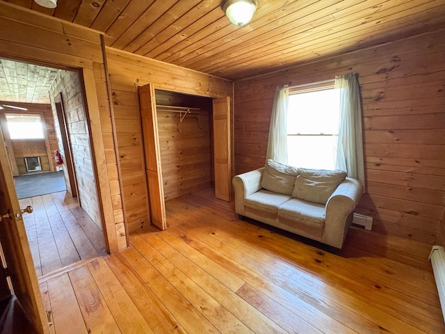 111 Fryes Ln, Greenbush, ME 04418 - unfurnished room with wooden walls, wooden ceiling, and light wood-style floors