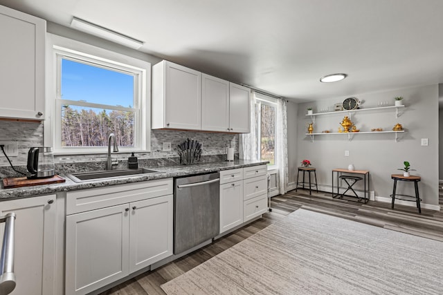 48 Albion Rd, Windham, ME 04062 - kitchen with stainless steel dishwasher, a sink, decorative backsplash, and dark wood-style flooring