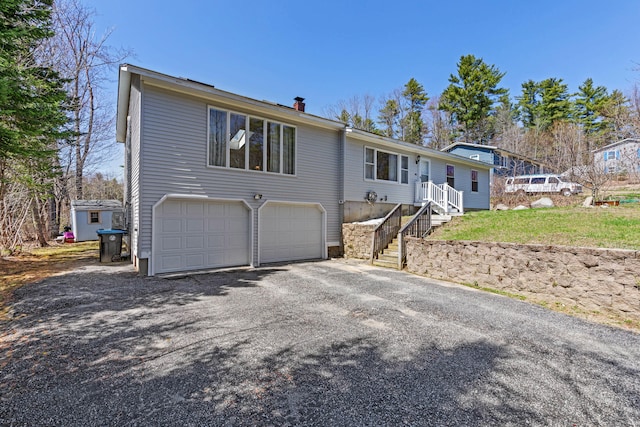 48 Albion Rd, Windham, ME 04062 - ranch-style home featuring an attached garage, asphalt driveway, and a chimney