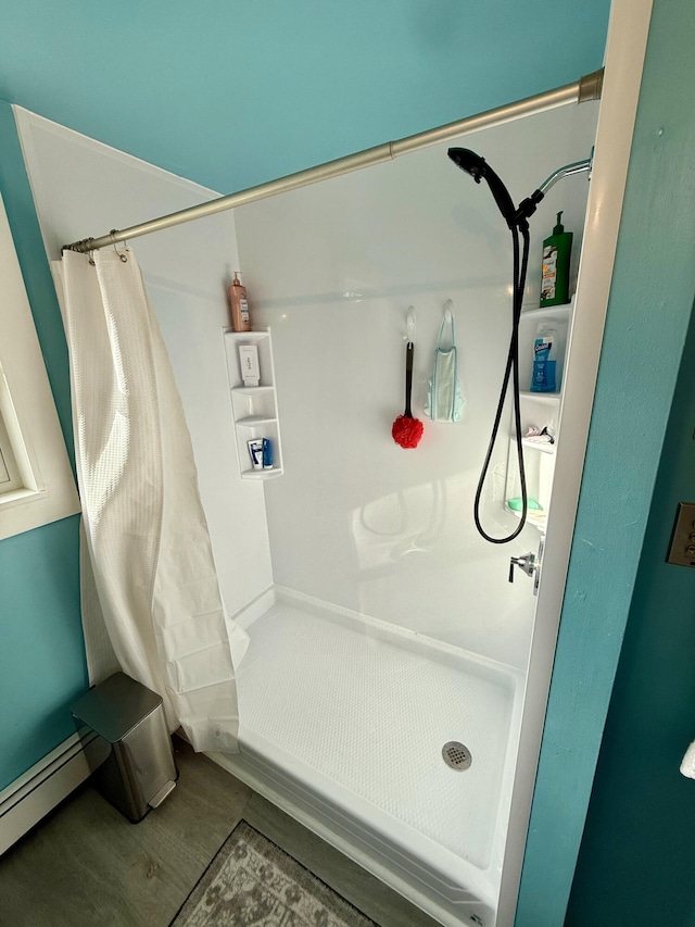 48 Albion Rd, Windham, ME 04062 - bathroom featuring curtained shower, wood finished floors, and a baseboard radiator