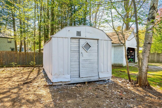 view of shed with fence