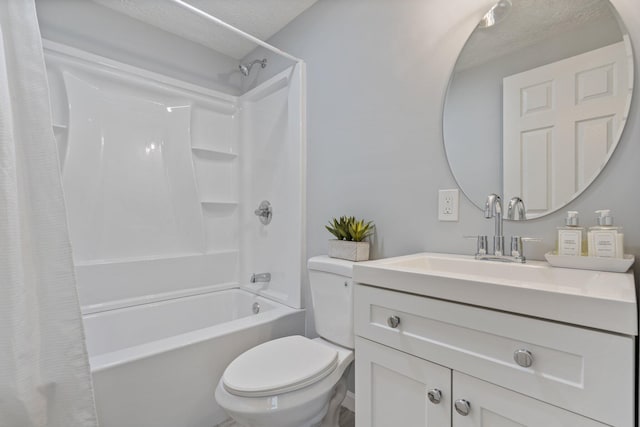 full bath featuring toilet, a textured ceiling, shower / bath combo with shower curtain, and vanity