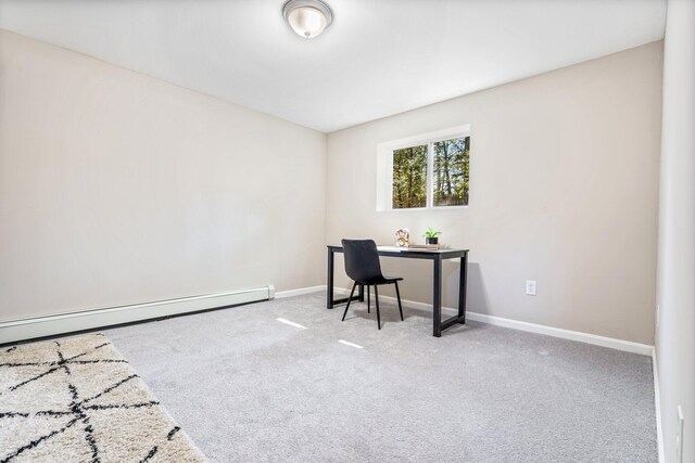 office with carpet floors, a baseboard radiator, and baseboards