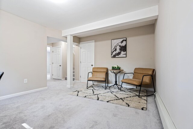 sitting room with carpet floors and baseboards