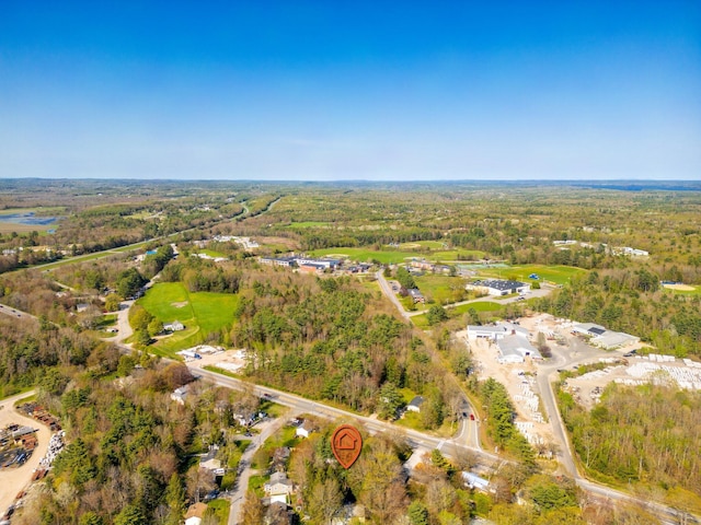 aerial view of property's location with a forest