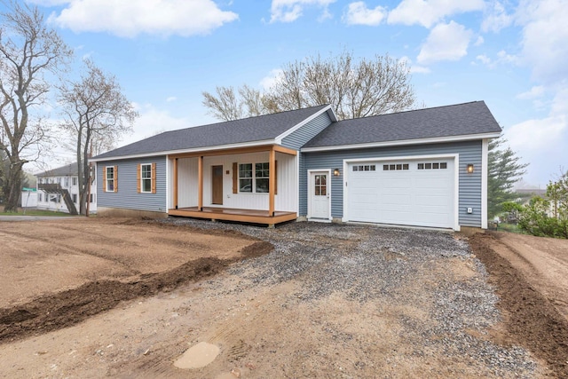 26 June St, Sanford, ME 04073 - ranch-style home featuring driveway, a garage, and covered porch