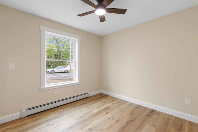 26 June St, Sanford, ME 04073 - spare room with baseboard heating, ceiling fan, light wood-style floors, and baseboards