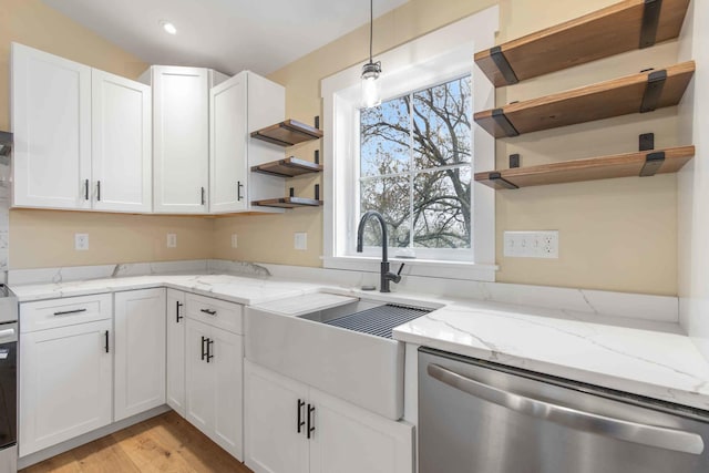 26 June St, Sanford, ME 04073 - kitchen with open shelves, dishwasher, white cabinetry, a sink, and light wood finished floors